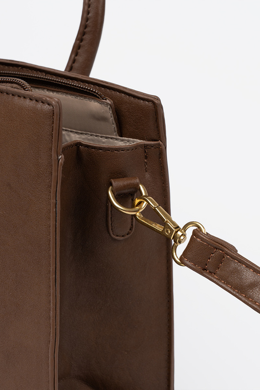 ruda rankinė su dekoratyvine sagtimi Į auksinism kolorze