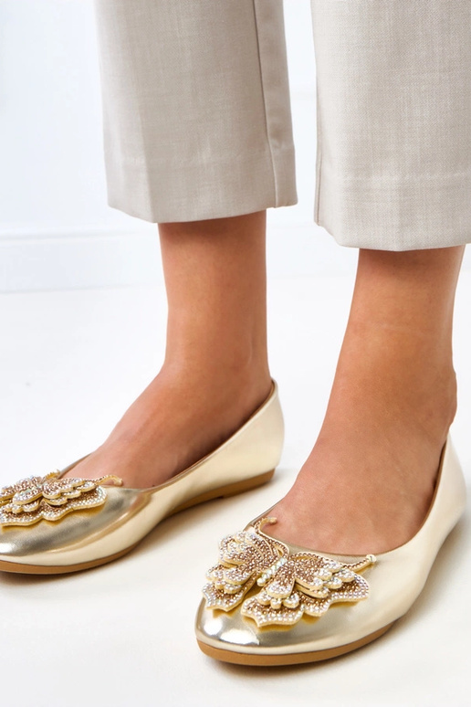 Auksinės balerinos su dekoratyviu... Auksinės balerinos su dekoratyviu...