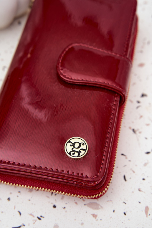 Lakuota moteriška piniginė su auksinėmis detalėmis raudonos spalvos Evlinne