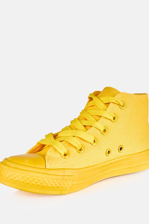 Geltoni vaikų sportbačiai virš...