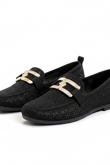 Juodi mokasinai puošti...