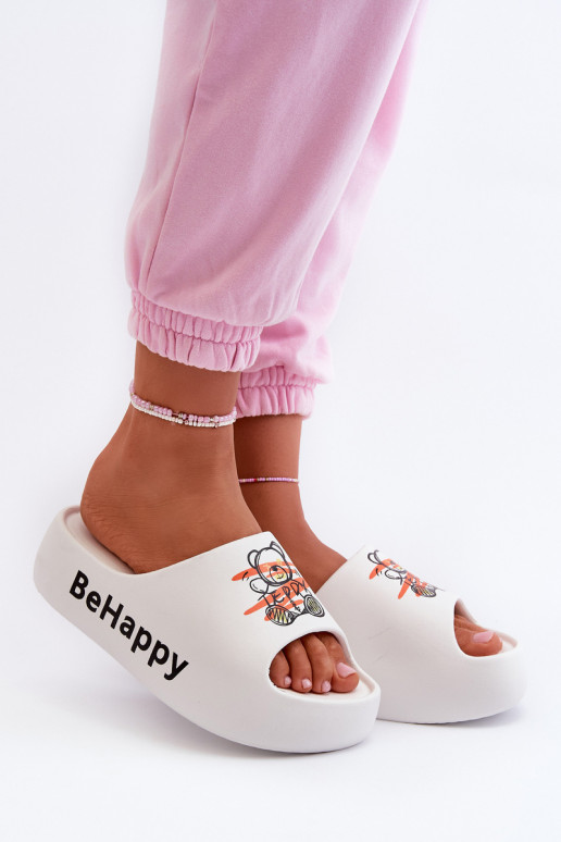 Lengva Moteriškos šlepetės su masyviu padu Su Meškiuku Lengvos šlepetės baltos spalvos Serefina Lengva Moteriškos šlepetės su masyviu padu Su Meškiuku Lengvos šlepetės baltos spalvos Serefina