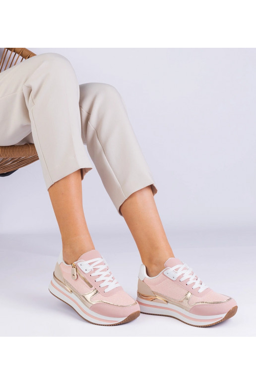 Rožiniai sportiniai sportbačiai ant...